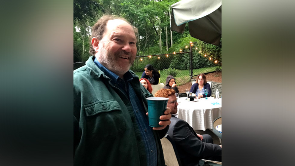 person holding a drink at a party