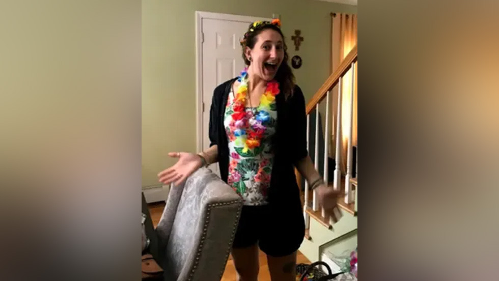 person posing for a photo wearing a Hawaiian lei