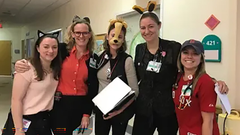 several people dressed up for Halloween